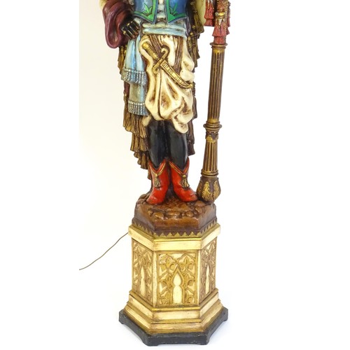 1419 - A mid 20thC blackamoor lamp, the lamp having a polychrome figural top grasping a torchiere, the figu... 