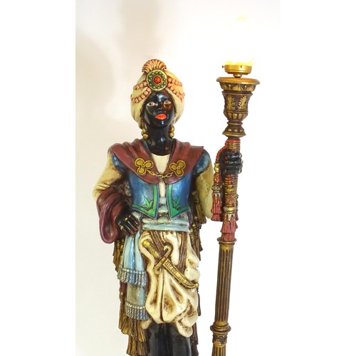 1419 - A mid 20thC blackamoor lamp, the lamp having a polychrome figural top grasping a torchiere, the figu... 