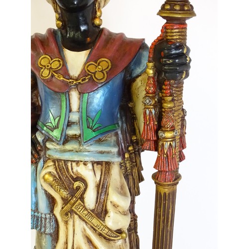 1419 - A mid 20thC blackamoor lamp, the lamp having a polychrome figural top grasping a torchiere, the figu... 