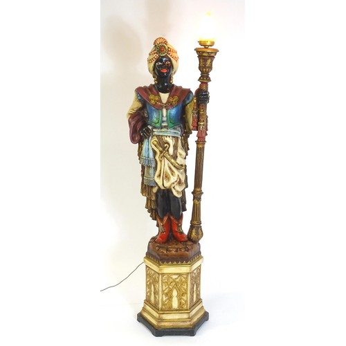 1419 - A mid 20thC blackamoor lamp, the lamp having a polychrome figural top grasping a torchiere, the figu... 