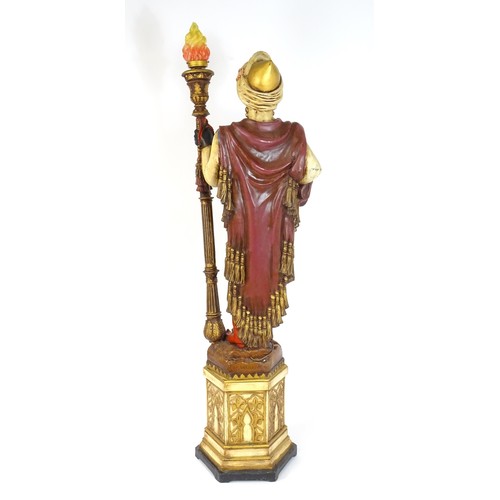 1419 - A mid 20thC blackamoor lamp, the lamp having a polychrome figural top grasping a torchiere, the figu... 