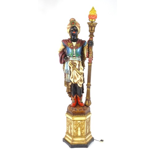 1419 - A mid 20thC blackamoor lamp, the lamp having a polychrome figural top grasping a torchiere, the figu... 