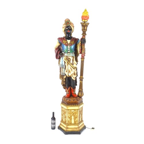 1419 - A mid 20thC blackamoor lamp, the lamp having a polychrome figural top grasping a torchiere, the figu... 