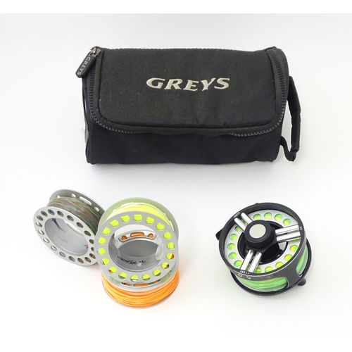 1122 - Fishing : a cased Greys GRX i+ centrepin fly reel and three spools (with line), the reel approx 3 3/... 