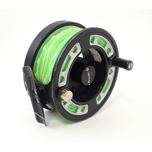 1122 - Fishing : a cased Greys GRX i+ centrepin fly reel and three spools (with line), the reel approx 3 3/... 