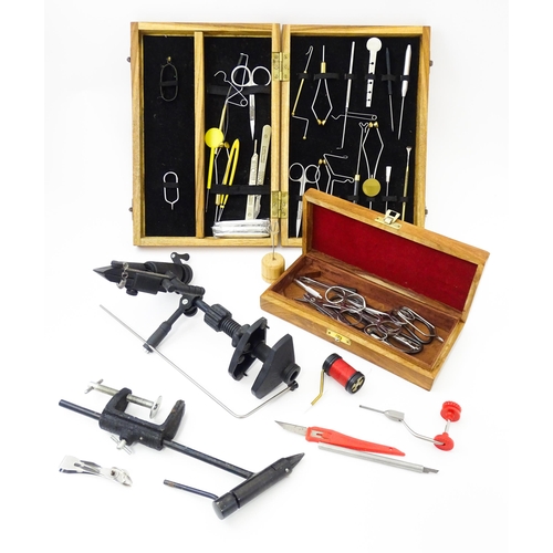 1126 - Fishing : a quantity of fly tying tools, to include two cases containing scissors, pliers, cotton, b... 