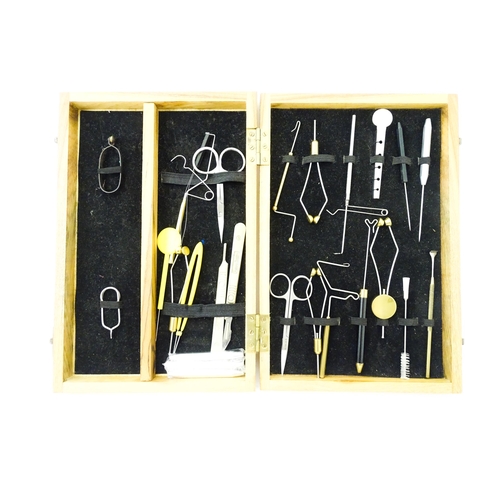 1126 - Fishing : a quantity of fly tying tools, to include two cases containing scissors, pliers, cotton, b... 