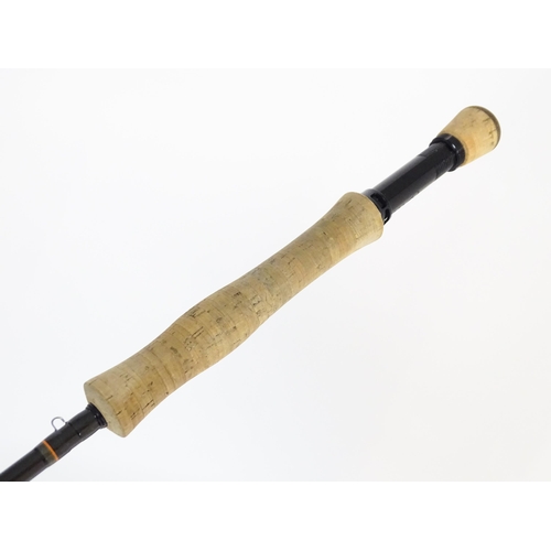 1129 - Fishing : a Scott (USA) 'Radian' carbon four-piece fly rod, serial number 402518, approx 114