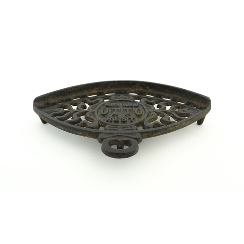 1112 - A late 19th / early 20thC Otto gas iron rest with stylised foliate detail, marked with patent no. 59... 