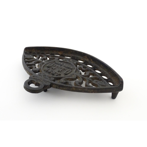 1112 - A late 19th / early 20thC Otto gas iron rest with stylised foliate detail, marked with patent no. 59... 