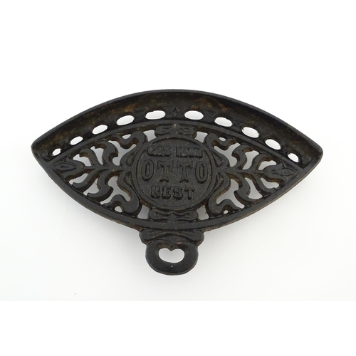 1112 - A late 19th / early 20thC Otto gas iron rest with stylised foliate detail, marked with patent no. 59... 