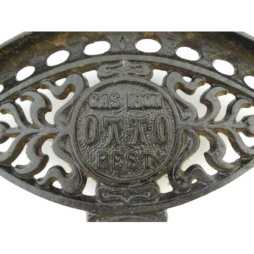 1112 - A late 19th / early 20thC Otto gas iron rest with stylised foliate detail, marked with patent no. 59... 