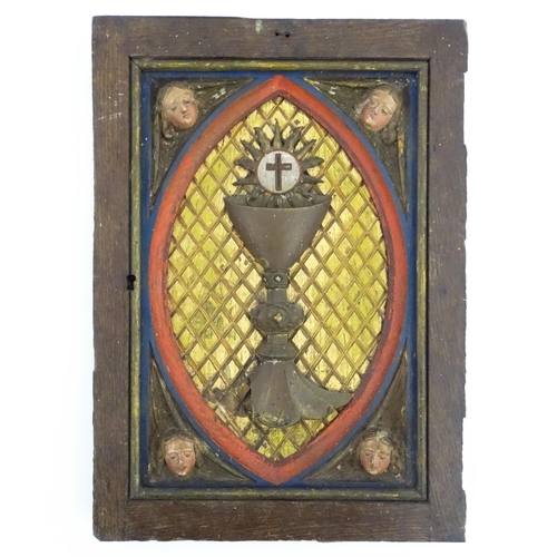 1117 - An early 20thC Continental tabernacle door with carved and polychrome decoration depicting a chalice... 