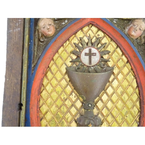 1117 - An early 20thC Continental tabernacle door with carved and polychrome decoration depicting a chalice... 