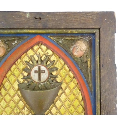 1117 - An early 20thC Continental tabernacle door with carved and polychrome decoration depicting a chalice... 