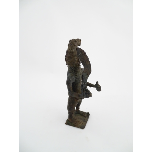 1137 - Ethnographic / Native / Tribal : An African cast bronze model of a warrior holding a weapon. Approx.... 