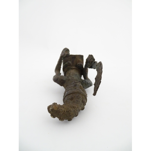 1137 - Ethnographic / Native / Tribal : An African cast bronze model of a warrior holding a weapon. Approx.... 