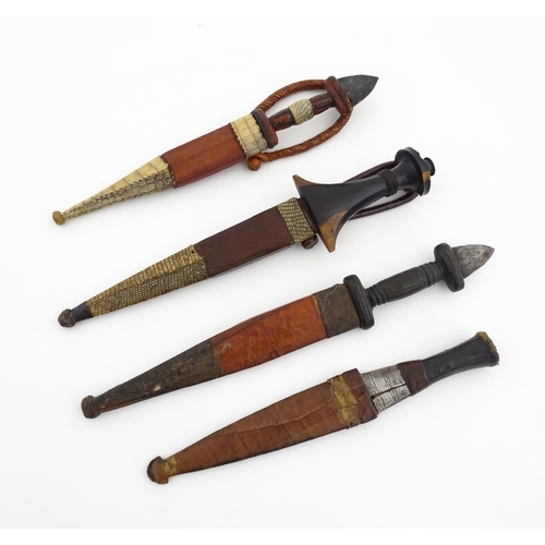 1138 - Ethnographic / Native / Tribal : Four assorted African / Sudanese arm knives / daggers, with leather... 