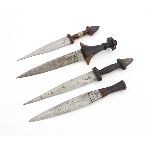 1138 - Ethnographic / Native / Tribal : Four assorted African / Sudanese arm knives / daggers, with leather... 