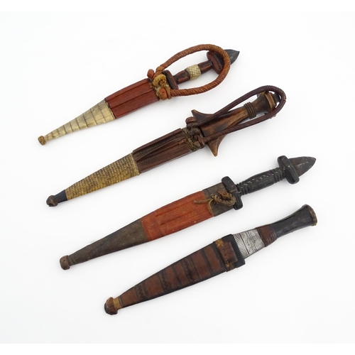 1138 - Ethnographic / Native / Tribal : Four assorted African / Sudanese arm knives / daggers, with leather... 