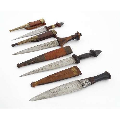 1138 - Ethnographic / Native / Tribal : Four assorted African / Sudanese arm knives / daggers, with leather... 