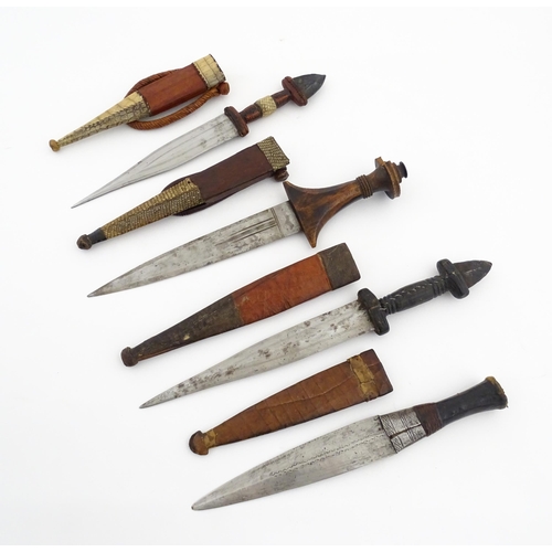 1138 - Ethnographic / Native / Tribal : Four assorted African / Sudanese arm knives / daggers, with leather... 