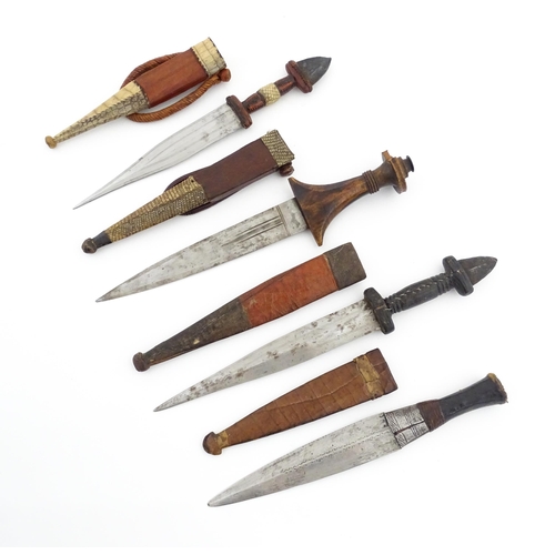 1138 - Ethnographic / Native / Tribal : Four assorted African / Sudanese arm knives / daggers, with leather... 