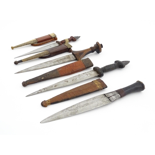 1138 - Ethnographic / Native / Tribal : Four assorted African / Sudanese arm knives / daggers, with leather... 