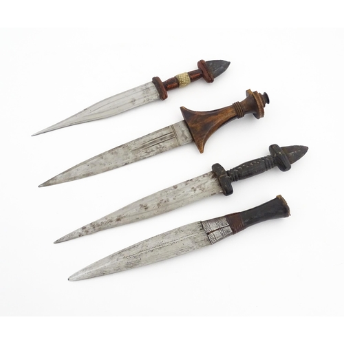 1138 - Ethnographic / Native / Tribal : Four assorted African / Sudanese arm knives / daggers, with leather... 