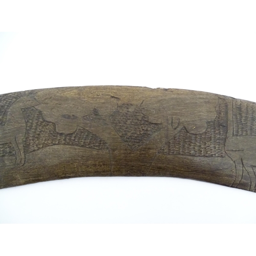 1140 - Ethnographic / Native / Tribal : A large Australian carved wooden boomerang with engraved decoration... 