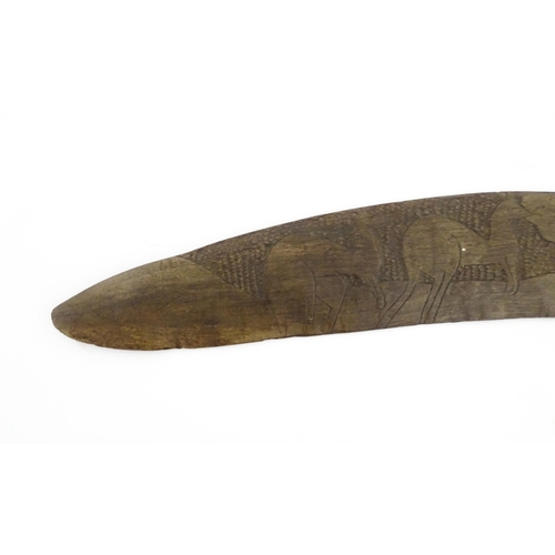 1140 - Ethnographic / Native / Tribal : A large Australian carved wooden boomerang with engraved decoration... 