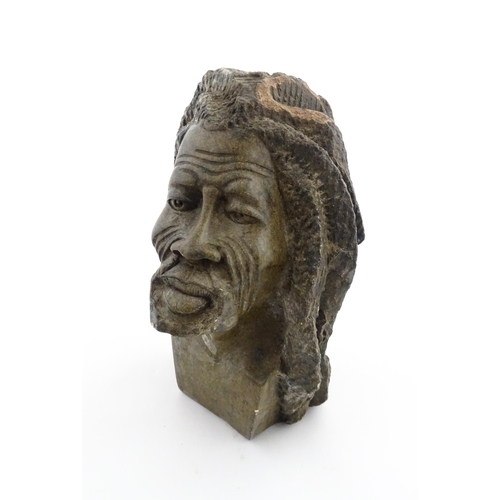 1148 - Ethnographic / Native / Tribal : An African carved soapstone bust modelled as a man with dreadlocks.... 