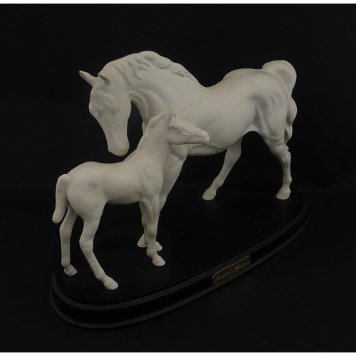 126 - A Royal Doulton model Spirit of Affection depicting white horse and foal. Marked under, and having p... 