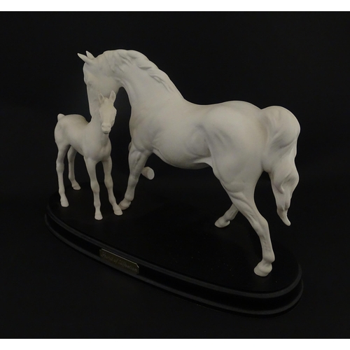 126 - A Royal Doulton model Spirit of Affection depicting white horse and foal. Marked under, and having p... 