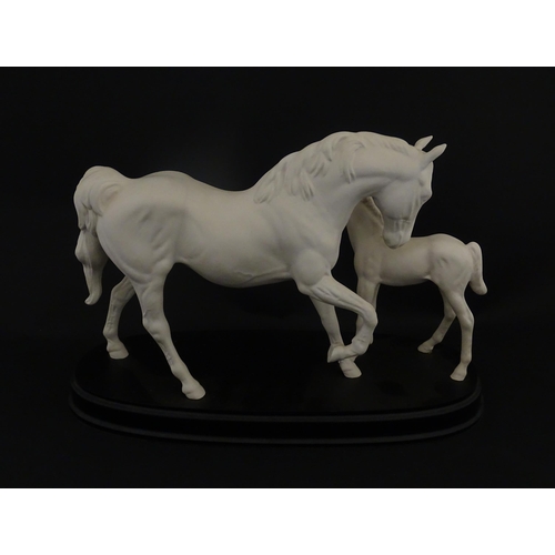 126 - A Royal Doulton model Spirit of Affection depicting white horse and foal. Marked under, and having p... 