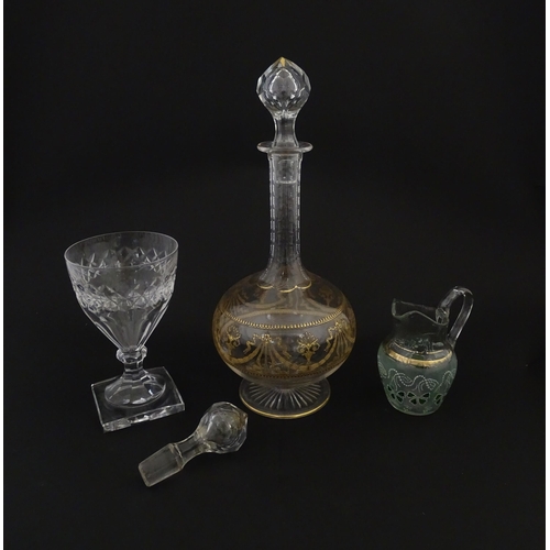 229 - Three items of glassware comprising a Val Saint Lambert glass with squared foot, a decanter with gil... 