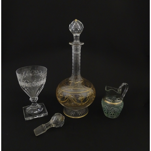 229 - Three items of glassware comprising a Val Saint Lambert glass with squared foot, a decanter with gil... 