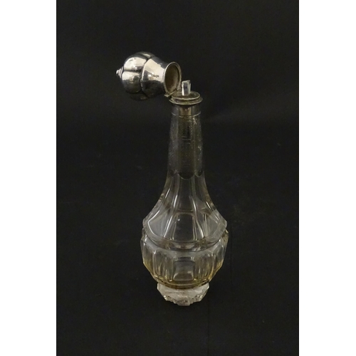 234 - A glass scent / perfume bottle with a Dutch silver top, c. 1810. Approx. 4 3/4