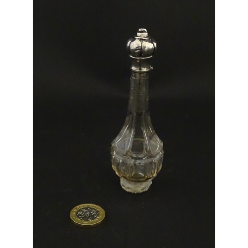 234 - A glass scent / perfume bottle with a Dutch silver top, c. 1810. Approx. 4 3/4