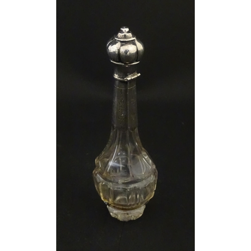 234 - A glass scent / perfume bottle with a Dutch silver top, c. 1810. Approx. 4 3/4