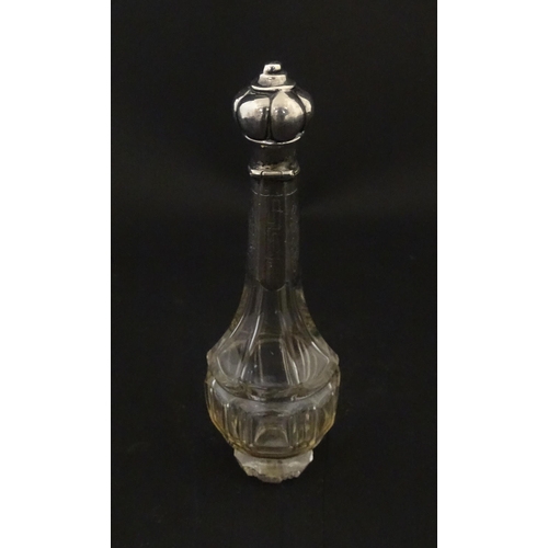 234 - A glass scent / perfume bottle with a Dutch silver top, c. 1810. Approx. 4 3/4