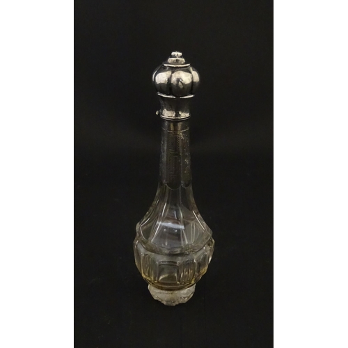 234 - A glass scent / perfume bottle with a Dutch silver top, c. 1810. Approx. 4 3/4