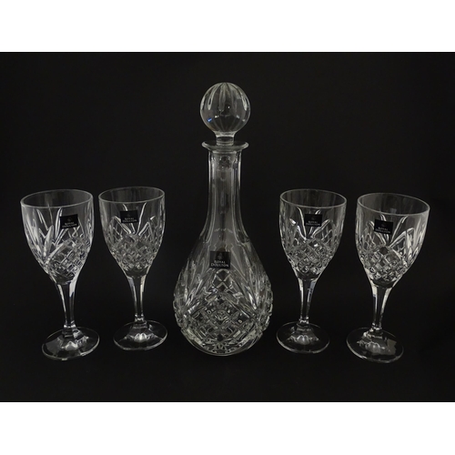 238 - Four cut glass wine glasses and decanter by Royal Doulton. Boxed. Decanter approx. 10 1/4