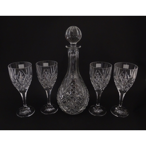 238 - Four cut glass wine glasses and decanter by Royal Doulton. Boxed. Decanter approx. 10 1/4