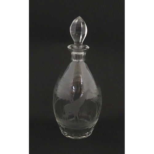 175 - A Rowland Ward glass decanter with engraved Safari animal detail. Unsigned  Approx. 11 1/4