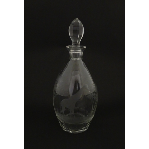 175 - A Rowland Ward glass decanter with engraved Safari animal detail. Unsigned  Approx. 11 1/4