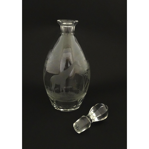 175 - A Rowland Ward glass decanter with engraved Safari animal detail. Unsigned  Approx. 11 1/4