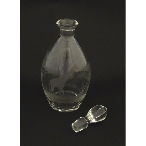 175 - A Rowland Ward glass decanter with engraved Safari animal detail. Unsigned  Approx. 11 1/4