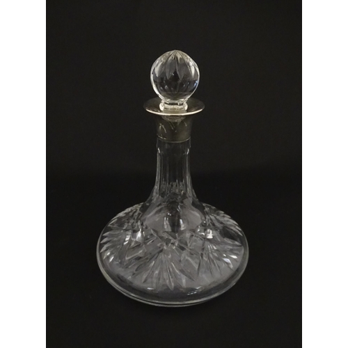 193 - A cut glass flask of small ships decanter form with silver collar hallmarked Birmingham 1988, maker ... 