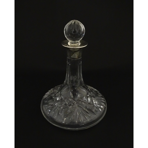 193 - A cut glass flask of small ships decanter form with silver collar hallmarked Birmingham 1988, maker ... 